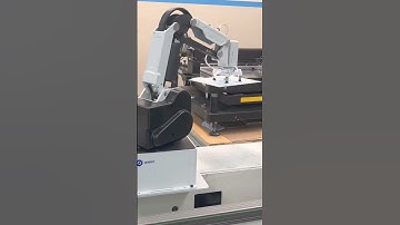 Robot in operation. The electronic plate is placed in a machine that then places the SMD led’s.