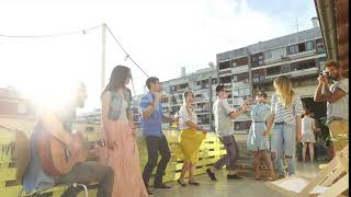 Happy people dancing and playing guitar at the rooftop party on sunny day | Stock Footage - Enva...