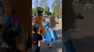 Alice And The Mad Hatter Walking Through Fantasyland Near Its A Small World - Disneyland 11422