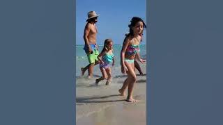 Kids are playing on the beach with sand and having fun. Miami Beach. White soft sand. Sun & Fun.