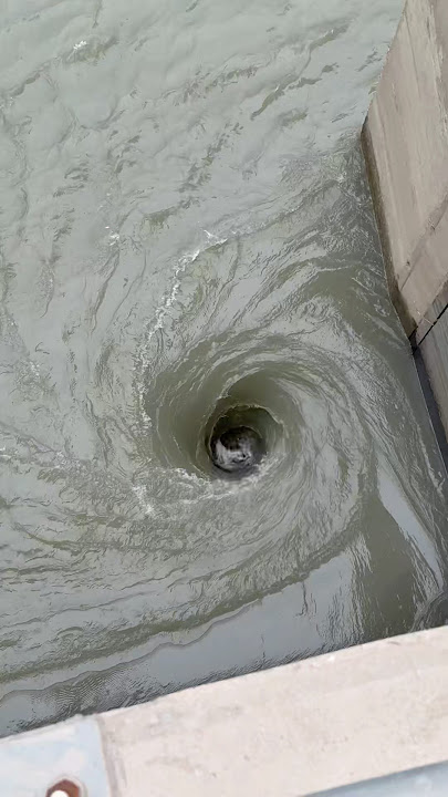 Shocking Impact: Dam Gates Opening Creates a Dangerous Vortex/black hole