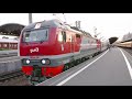 departing of EP2K DC electric passenger locomotive with passenger express Saint-Petersburg to Moscow