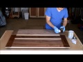 Applying a first coat of shellac to a table top Applying a first coat of shellac to a table top