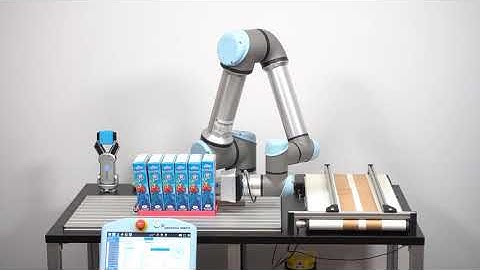 Universal Robots UR5e cobot picking and stacking food boxes in tray