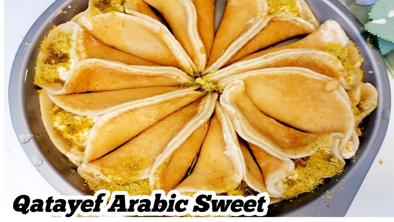 Qatayef Middle Eastern Dessert Qatayef With Cream Arabic Sweet by qatayef-middle-eastern-dessert-qatayef-with-cream-arabic-sweet-by