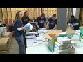 Evergy employees lend hand to Topeka diaper bank for National Volunteer Month