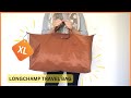 Guess how much fits inside longchamp le pliage xl travel bag  cognac  green collection