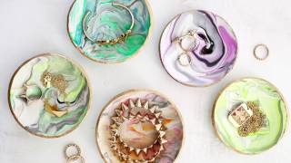 Make your own marbled ring dishes out of oven baked clay! see the full
tutorial here:
http://www.abeautifulmess.com/2014/11/marbled-clay-ring-dish.html
video...
