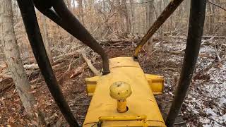 Clearing pine with John Deere 450C dozer