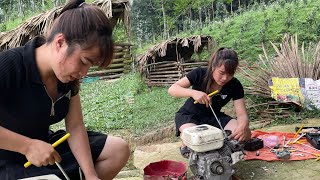 The genius girl repairs and fixes the grain threshing machine