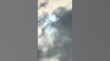UFO spotted shooting through clouds during solar eclipse 👀 🛸