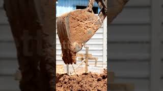 Excavator at Work on Farm Site: Soil