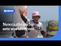 Newcastle surfer sets world record by catching 7,000 waves in a month | ABC NEWS