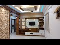 Ravi MyHome Interiors 2 BHK Interiors,Wardrobe with Tv Unit Design.