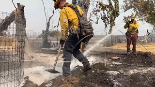 Crews mop up after destructive California wildfire