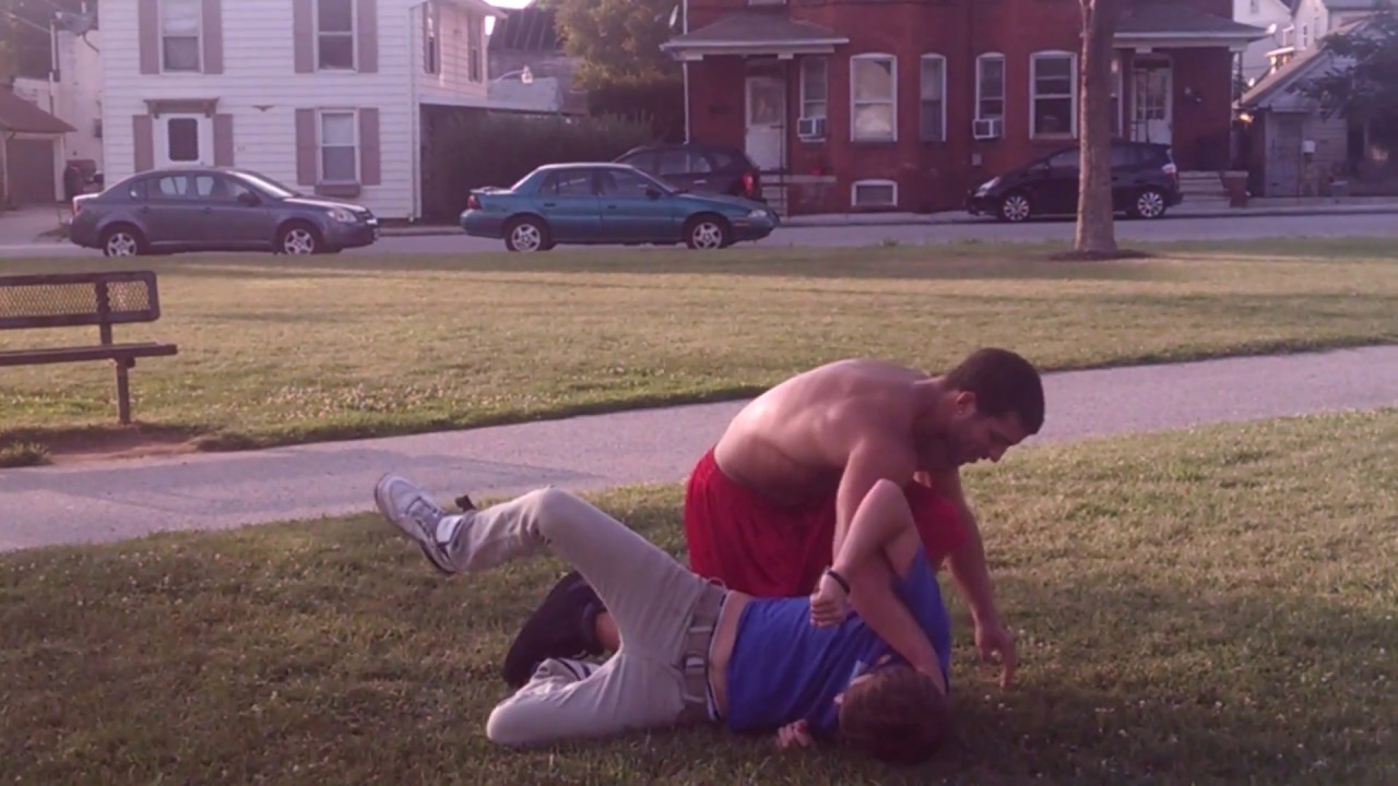 Messing around with friends at park wrestling