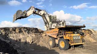 TRUCK 777D CATERPILLAR LOADING OVER BURDEN ON LIEBHERR 9350 EXCAVATOR ~ MININGSTORY