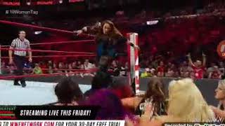 Ronda rousey locks Mickie James in an armbar during the main event