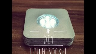 DIY Idee: beleuchteter Upcycling Flaschen Sockel aus Bierdeckel für die Bar