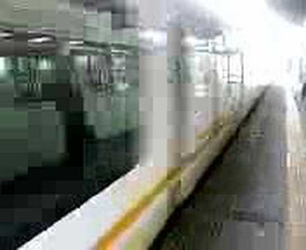 Ise Liner Kintetsu Express train passing Yokkaichi Station at speed.