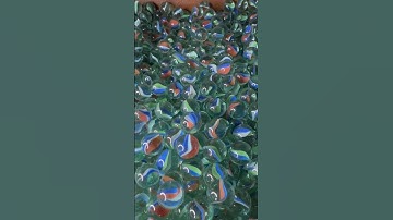 What happens when you put marbles in a rock tumbler?