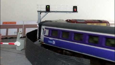 A class 67 with sleeper passes by at high speed.