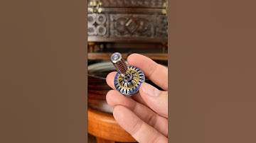 Titanium and bronze spinning top