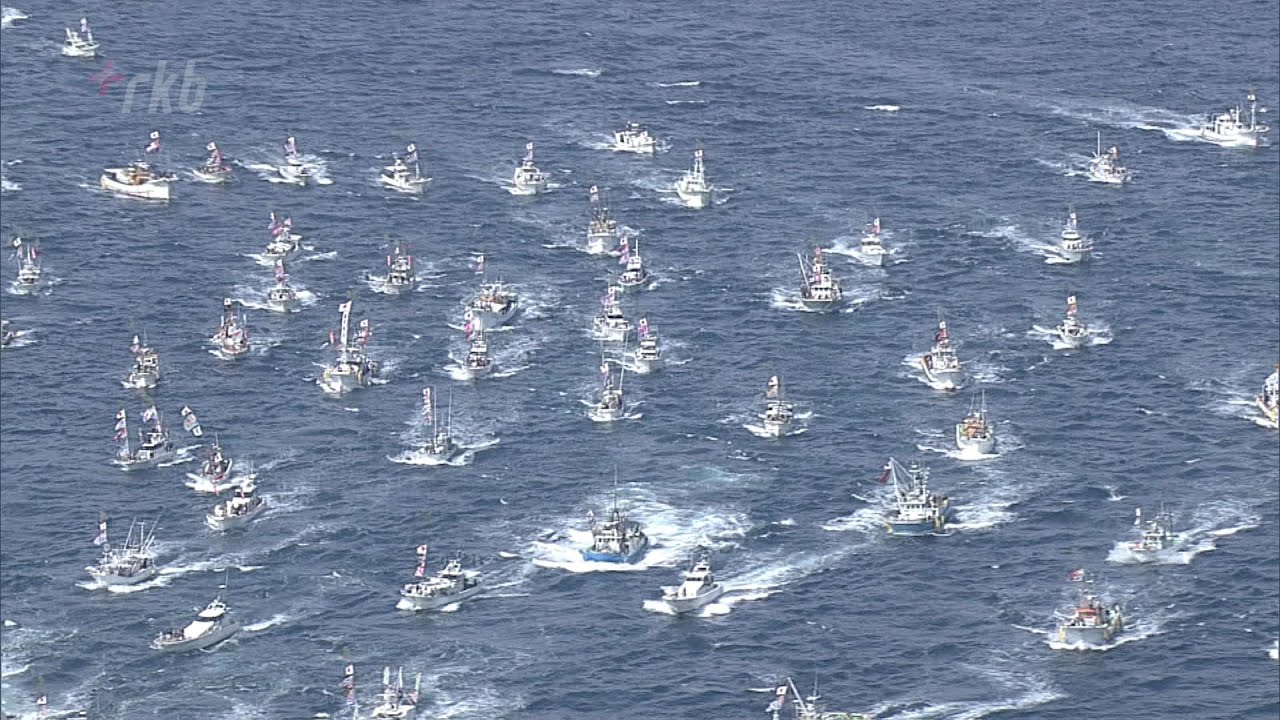 120 fishing boats parade on the water at Munakata Taisha Shrine's