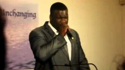 Rev. Corey Carr preaching at JRM