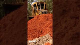 Cat D3 pushing red dirt!