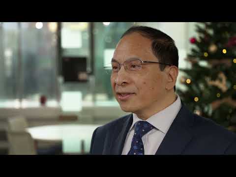 Interim Vice Chancellor and President Hai-Sui Yu congratulates graduating students