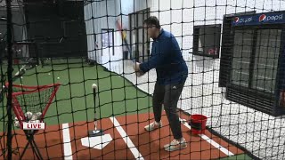 Keith Kaiser gets a lesson in hitting at The Bat Cave