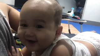 7 month old Zed biting mommy’s shorts
