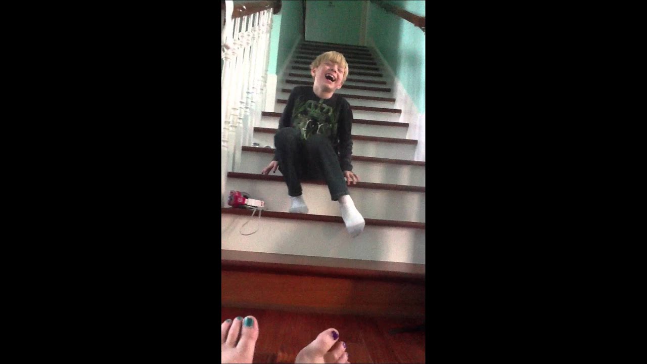 Kid slides down stairs