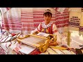В Витебске на глазах горожан мастера традиционного ткачества ткут пояса, рушники, дорожки