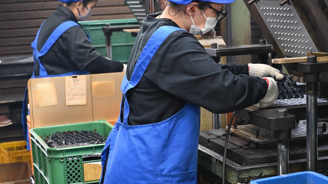The process of mass producing rubber parts. Japanese factory producing 100,000 rubbers per day.