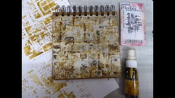 Creating a background using strips of inky paper and gesso, along with Infusion sprays.