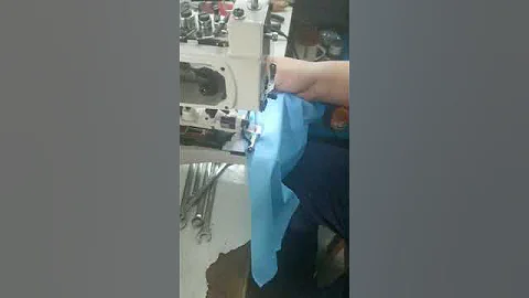 UN373DD Shank button attaching machine