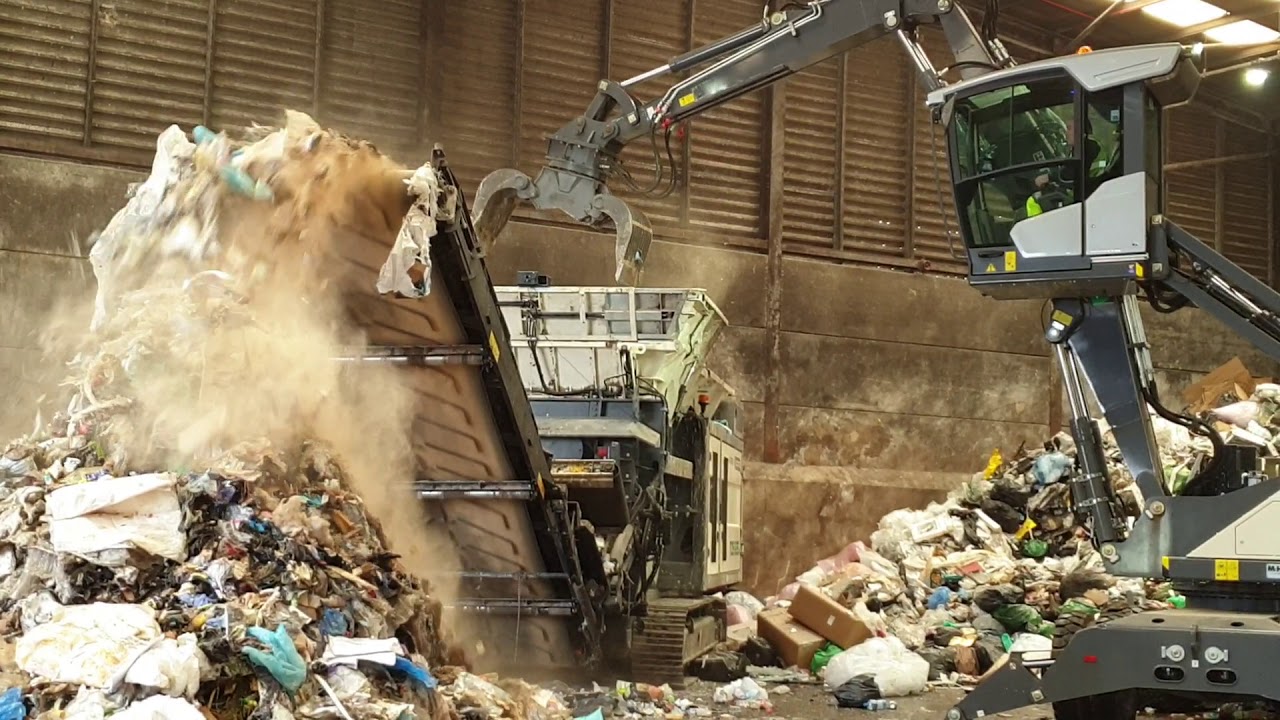 Waste Rehandler TWH 220 Waste Handler & TDS 825 Slow Speed Shredder - YouTube