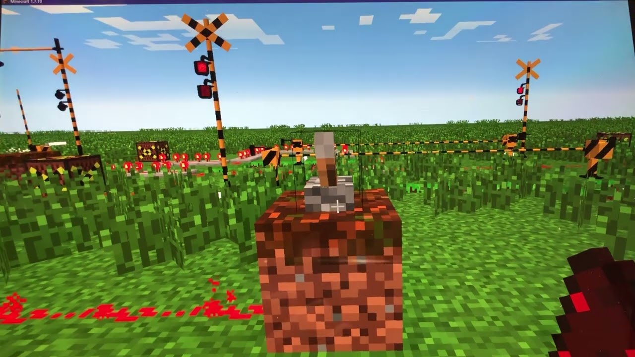 遮断機が4本の踏切