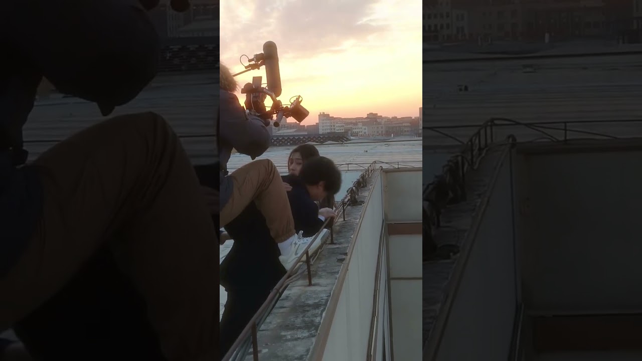 A mother was strangled by a man on the rooftop while filming and attempted to murder her 