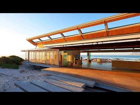 Video: Modern Holiday Home di Selandia Baru: Disaring oleh Pohutukawa