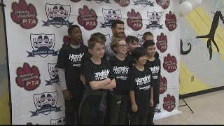 Harmony Elementary students welcome special guest NASCAR champion Kyle Larson