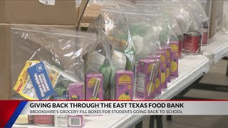 Brookshire Grocery volunteers pack food at East Texas Food Bank