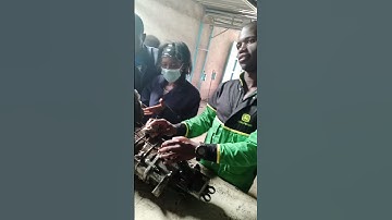 mechanics at work servicing the gearbox