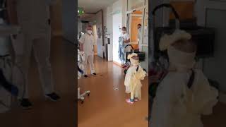 Eva dancing and having fun with doctors and nurses