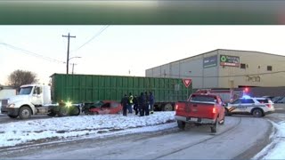 One person injured in west Toledo crash involving car under truck