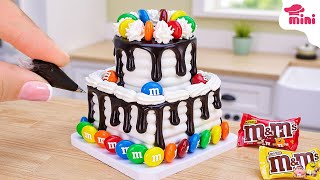 The Miniature M M Chocolate Drizzle Tower Cake A Sweet Sensation Mini Bakery