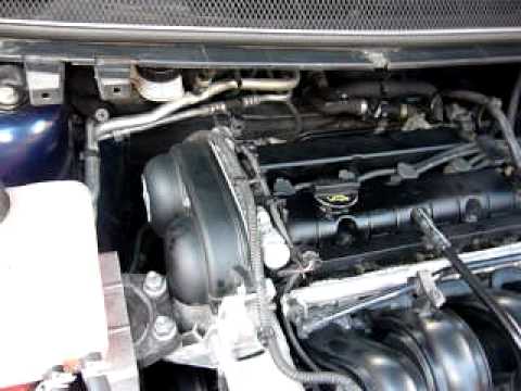 What causes a tapping noise in the engine of a minivan?