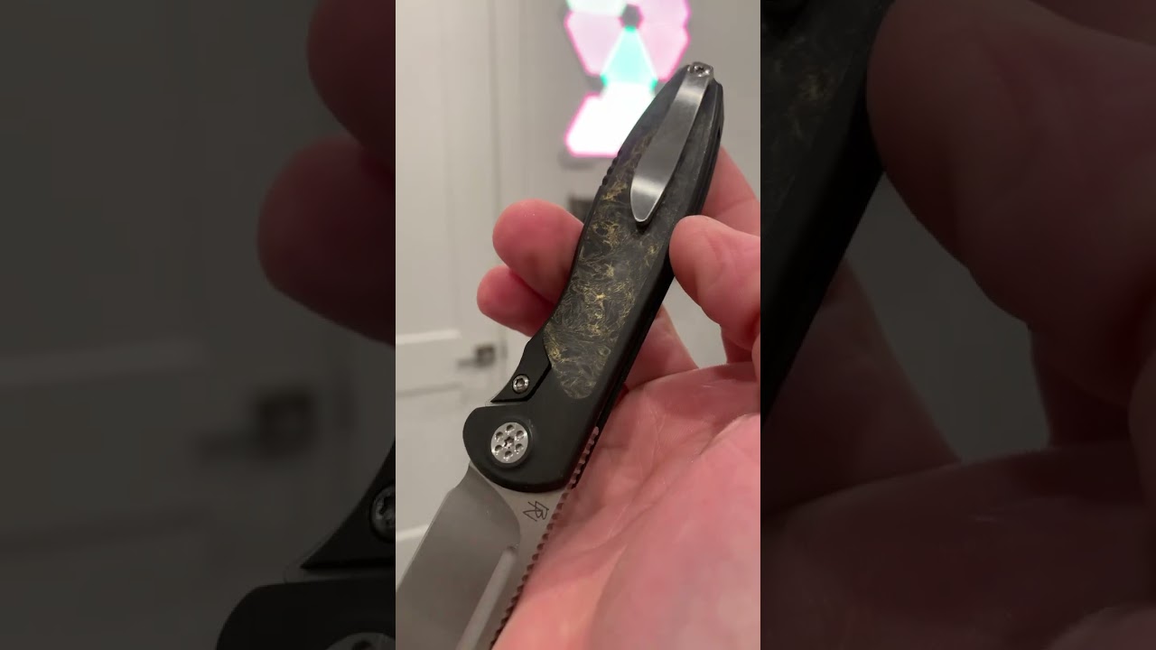 Sharp by Deisgn: Tempest. Gold marbled CF. Dark Ti. Thumb flips as well as it spydie flicks.